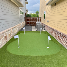 Backyard-Redesign-with-Artificial-Turf-Putting-Green-Landscape-Rock-Installation-in-McKinney-TX 4